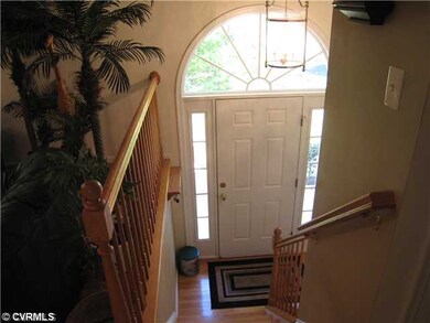 Foyer - Palladian window, oak hardwood floors at e