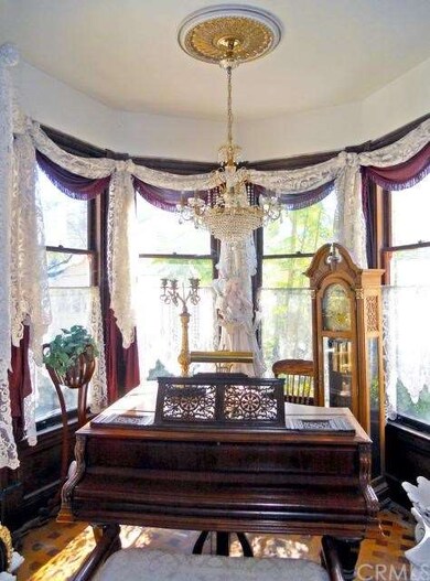 This rounded piano alcove is to the left of the fr