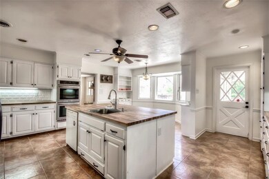 Large updated kitchen with breakfast area and door