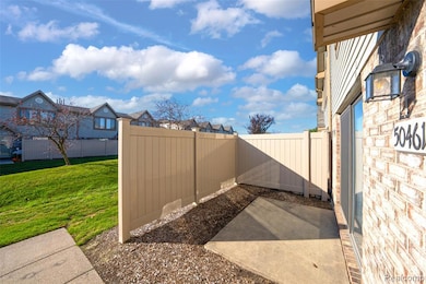 Fenced backyard featuring a patio and a residential view