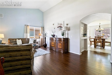 Expansive front room with LVP. Walls have fresh paint and are all a nuetral off-white, not blue.