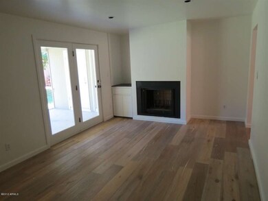 family room w/ fireplace and hardwood fl