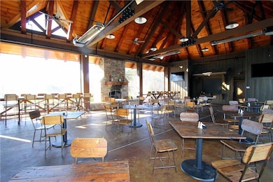 Dining space featuring wood ceiling, an outdoor st