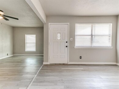 Foyer entrance featuring light hardwood / wood-sty