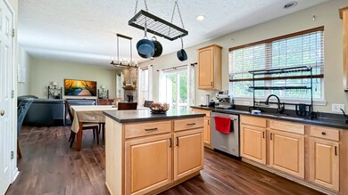 The Kitchen Island features the same Corian countertops.