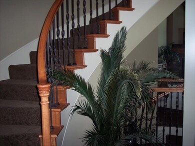 The offers a curved staircase of the entry as well