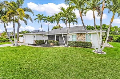 Single story home featuring concrete driveway, stone siding, a shingled roof, a front lawn, and a garage
