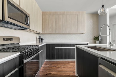 Kitchen featuring stainless steel appliances, mod