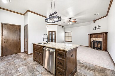 Kitchen island with sink and dishwasher.