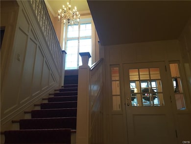 Detailed woodwork and craftsmanship in the foyer w