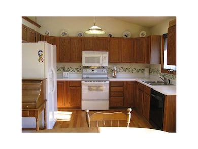 Kitchen. Many cabinets, all appliances, and vaulte