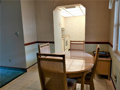 Dining area with view into kitchen
