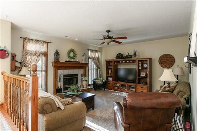 Kitchen overlooks great room.  Custom window treat