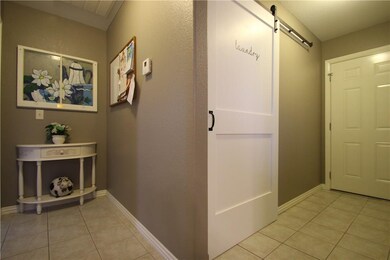 This floor plan rocks.  Garage entry door is to the right.  Master Bedroom Suite is to the left of the white table.