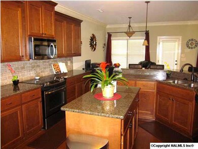 Large island is just one of the many features of this super kitchen. So are Stainless/black appliances!