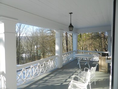 The two tiered porches on the front of the home af