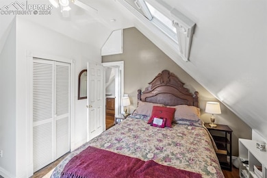 Bedroom with hardwood / wood-style flooring, ceili
