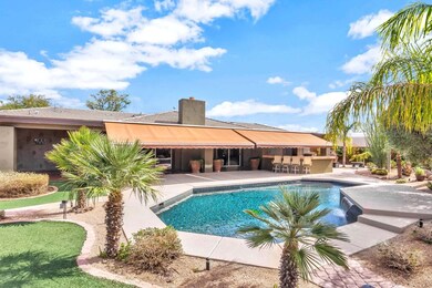 Rear View of this Resort Style Backyard