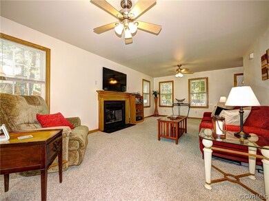 Family room with gas fireplace and NEW CARPET comi