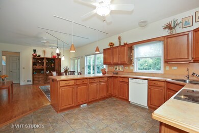 Kitchen with high end vinyl flooring. Peninsula ov
