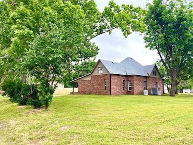 View of side of property featuring brick siding