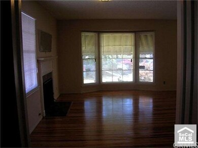 View from dining area with bay window in living ro