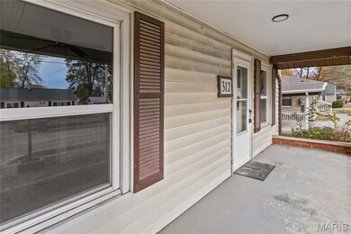 Entrance to property with covered porch