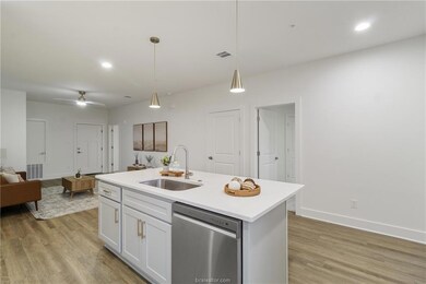 Kitchen with dishwasher, open floor plan, light wo