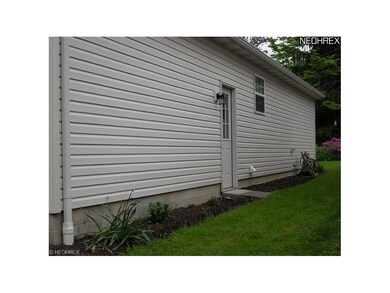 Side door entrance to garage.