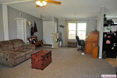 Looking towards front entry door and office or 2nd