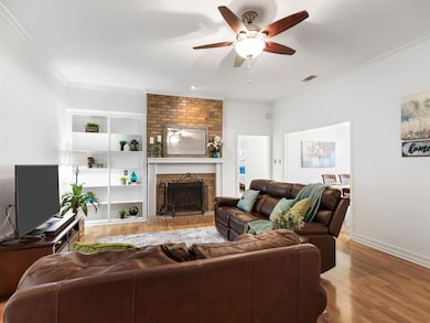Spacious Living Area Features Floor to Ceiling Bri