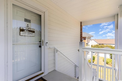 Doorway to property with a balcony
