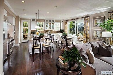 Open floor plan living and dining room (photo is o