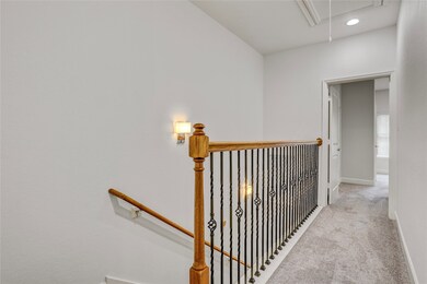 This inviting third-floor landing serves as a quie