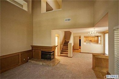 View from Living room to dining room and kitchen.