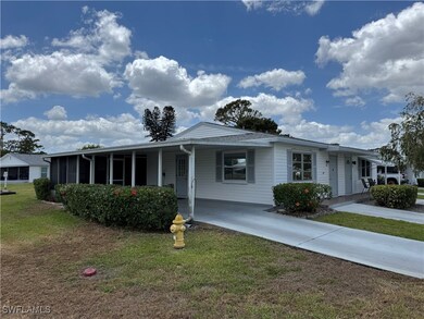 Single story home featuring concrete driveway, a f