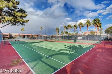 View of tennis court featuring community basketball court