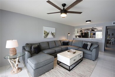 Tiled living room with ceiling fan