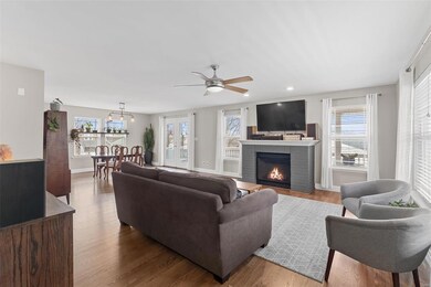 Recently refinished hardwood floors flow throughou