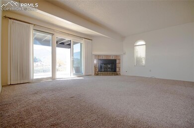 Living room from entry looking to patio with views