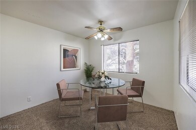 Virtually staged dining room with ceiling fan/ligh