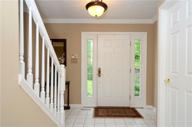 The inviting entry offers ceramic tile floors, cro