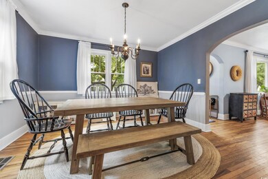Dining area with an inviting chandelier, ornamenta