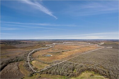 Birds eye view of property featuring a rural view
