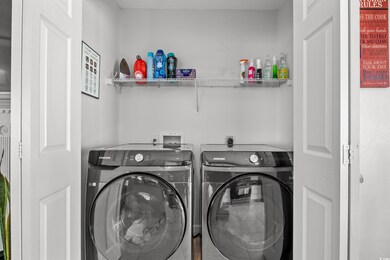 Washroom featuring washing machine and clothes dryer
