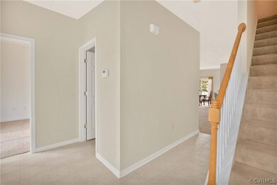 Entroy foyer with tile and neutral paint.
