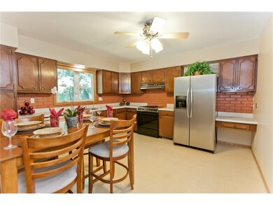 Large kitchen with lots of cabinets for storage.