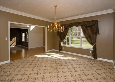 Just adjacent to the entryway, this formal dining 