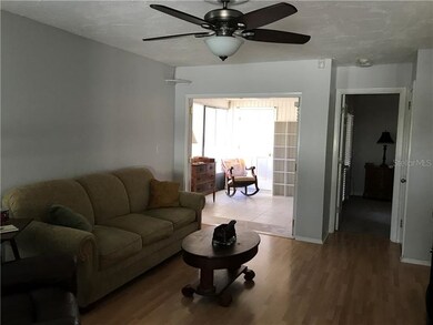 Living Room with view to sun room and master bedro