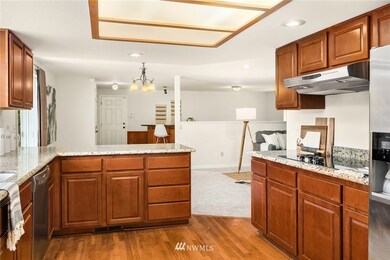 A view from the kitchen looking towards the family room and recreation space. 